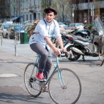 A young man rides a bicycle