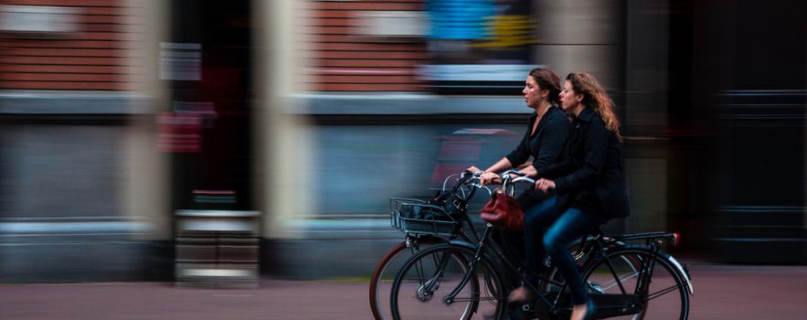 Two women riding bicycles